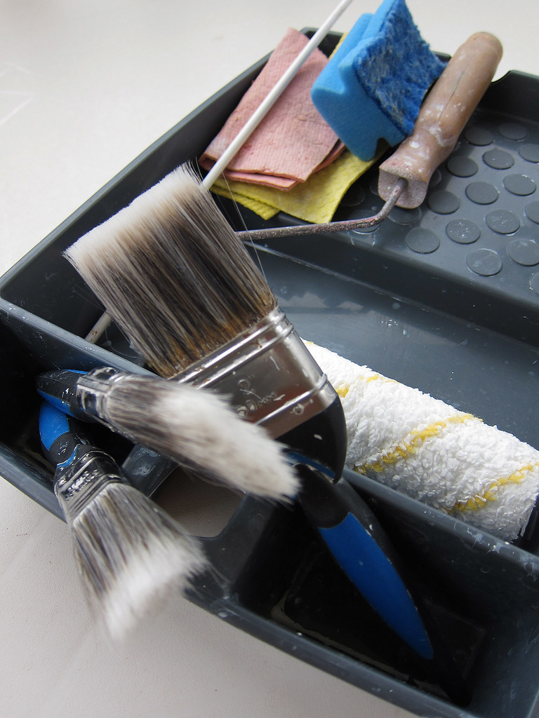 Brushes and roller laid out, ready for the job